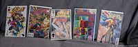 Group shot of all five bagged comics