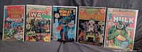 Front covers of all five bagged comics