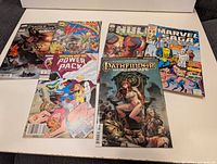 Group shot of all six bagged comics