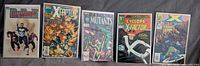 Group shot of five bagged and boarded Marvel single issues