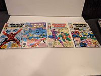 Four Marvel Saga comic books laid out
