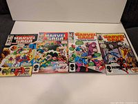 Five Marvel Saga comics laid out side by side on white background