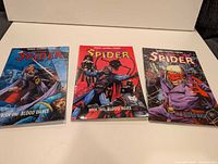 All three softcover comic volumes front covers