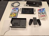 Overview: console, dock, grip, carrying case, HDMI cable, two Zelda game cases