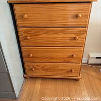 front view showing four drawers and knobs