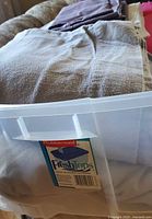 Bedding inside Rubbermaid FreshTops bin