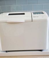 Front and side view of white Black & Decker breadmaker