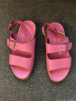 Top view of both pink sandals showing straps and buckles