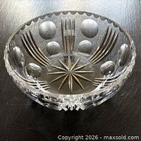 Oblique view of cut crystal bowl showing side pattern and rim