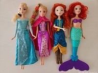 Front view of four Disney Princess dolls side by side