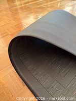 Mat rolled to show thickness and texture