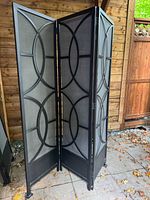 Full view of assembled 3-panel screen showing black frame and grey fabric