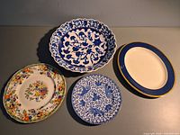Top view of all four serving plates showing patterns and shapes