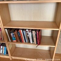 Front view showing full bookcase with three shelves