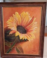 full view of framed sunflower painting