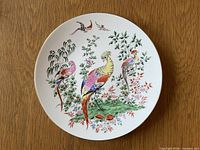 Front of plate showing bird design