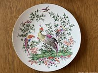 Front view of Royal Worcester Fabulous Birds collector plate