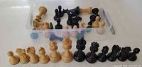 All 32 chess pieces lined up and in box