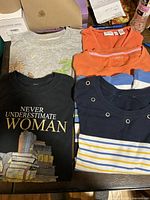 All five folded tops laid out