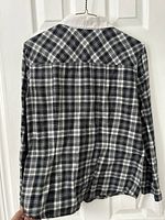 Rear view of plaid blouse showing pattern and back yoke