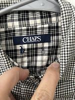 Interior label showing brand CHAPS and plaid lining