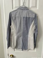 Rear view of blouse showing stripe panel layout