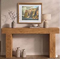 Framed lithograph displayed on console table