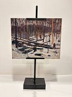Frontal view on stand showing full artwork