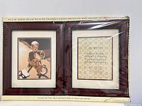 Front view of both walnut frames in original packaging