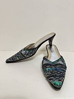 Both shoes shown side and top view displaying bead, sequin and embroidery detail and heel height