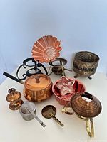 Group view of all copper, brass and metal items in lot