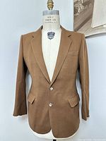 Front view of brown wool sport coat on form