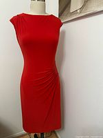 Front view of red stretch dress on form