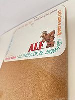 Full view of message board showing ALF graphic, cork section, and overall design