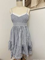 Front view of Tristan striped babydoll dress on dress form