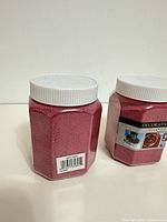 Back and angled view highlighting barcode and sand texture