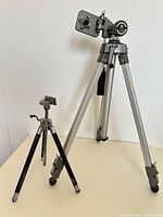 Both tripods standing for size comparison