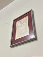 Framed artwork on wall showing entire piece