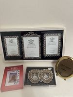 All frames in lot: boxed set of three, baby frame, double heart frame, brass frame
