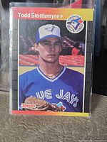 Front of Donruss card in sleeve showing Todd Stottlemyre portrait, Blue Jays logo, Donruss 89 mark