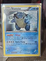 Front of Blastoise 31/149 card in sleeve
