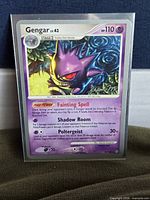 Front of Gengar 18/100 card in protective sleeve