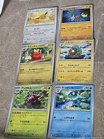 Front view of all six cards in sleeves