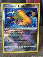 Front view of Radiant Jirachi holographic card showing artwork, set symbol and card details