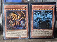 Both cards side by side in sleeves showing artwork and limited edition text