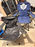 Toronto Maple Leafs blue chair and black chair unfolded