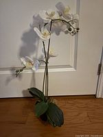 White orchid faux plant in black pot