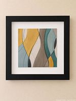Front view of square abstract art in black frame