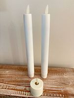 Front view showing two taper candles and one tealight candle