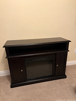 Full view of fireplace cabinet front